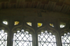 Fragments of 15th century coloured glass in the south window 